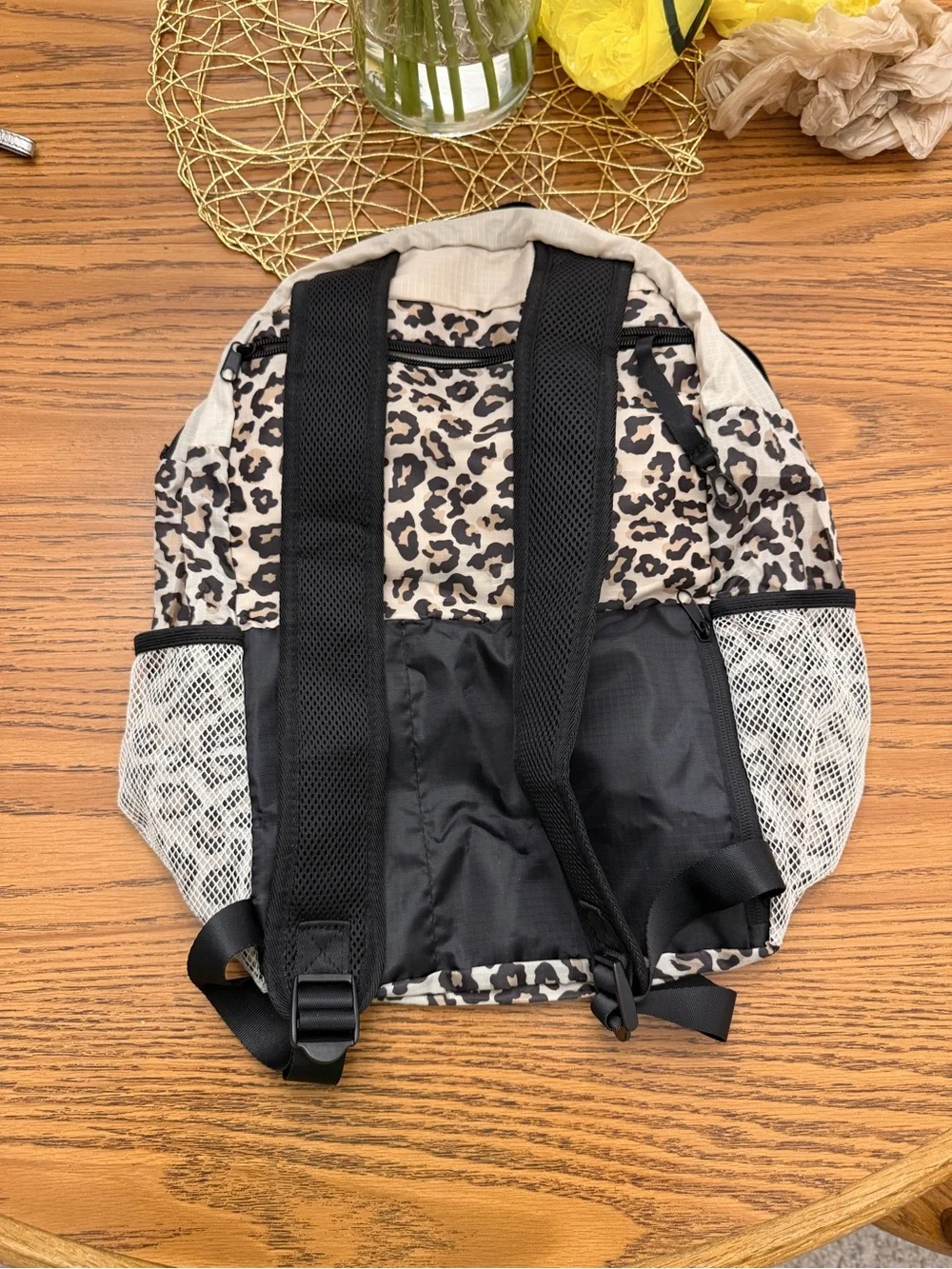 APL Beige TRAVEL Backpack with Leopard Accent and folds into small pouch..